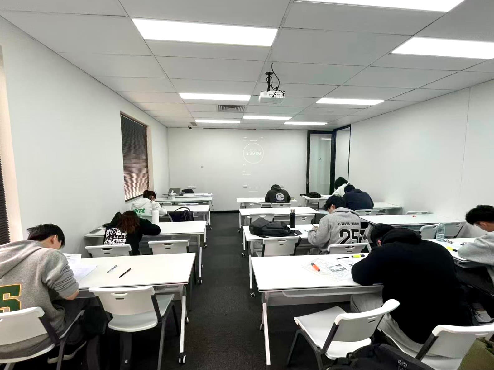 Students completing an Austin Education VCE practice exam in a supervised classroom
