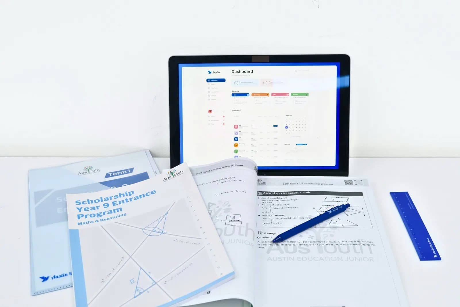 AusYouth scholarship workbooks beside the My Austin online learning dashboard